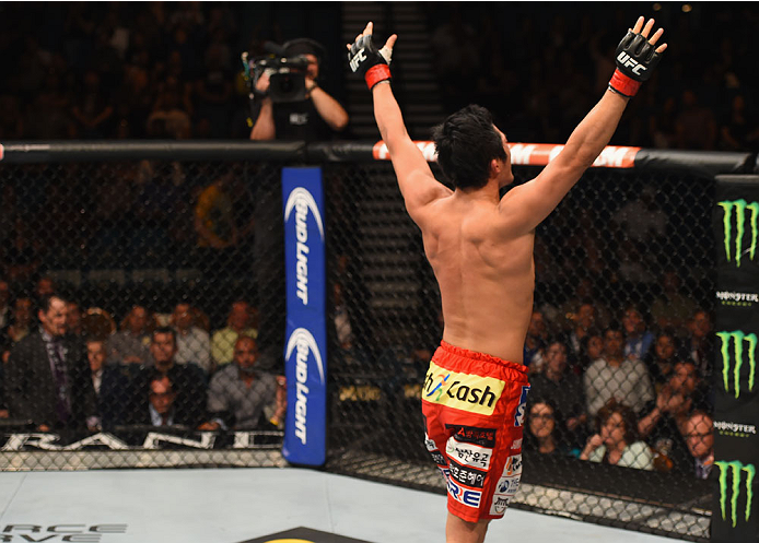 LAS VEGAS, NV - MAY 23:  Dong Hyun Kim reacts to his victory over Josh Burkman in their welterweight bout during the UFC 187 event at the MGM Grand Garden Arena on May 23, 2015 in Las Vegas, Nevada.  (Photo by Josh Hedges/Zuffa LLC/Zuffa LLC via Getty Ima