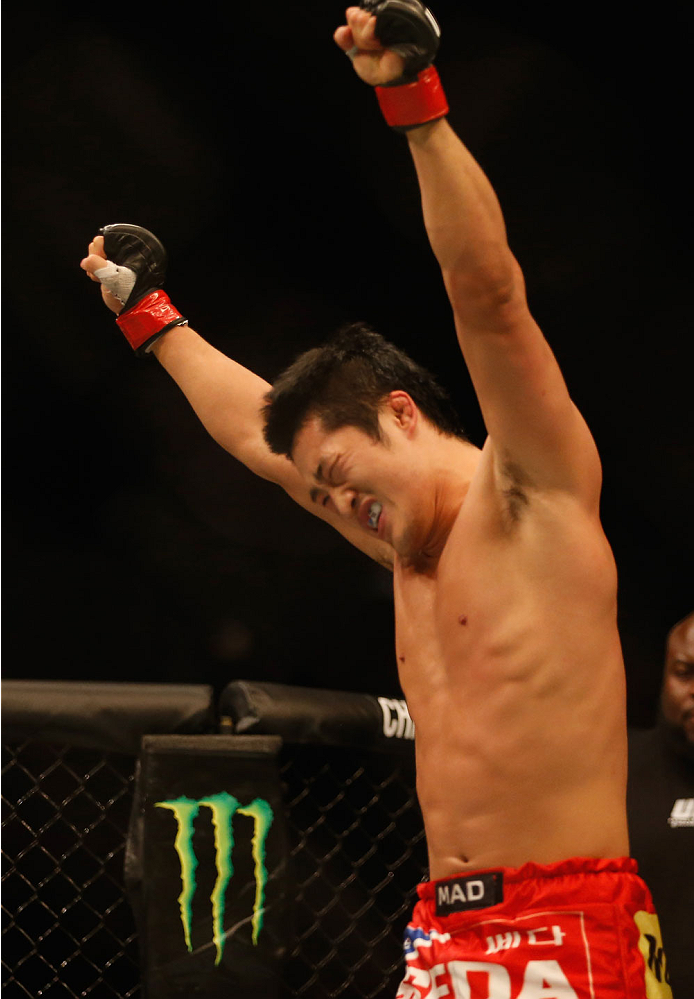 LAS VEGAS, NV - MAY 23:  (L-R) Dong Hyun Kim reacts to his victory over Josh Burkman in their welterweight bout during the UFC 187 event at the MGM Grand Garden Arena on May 23, 2015 in Las Vegas, Nevada.  (Photo by Christian Petersen/Zuffa LLC/Zuffa LLC 