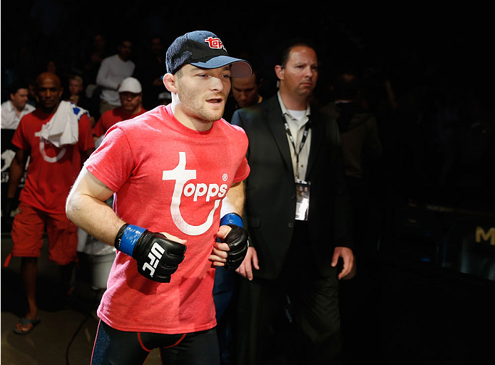 LAS VEGAS, NV - MAY 23:  Zach Makovsky runs to the Octagon to face John Dodson in their flyweight bout during the UFC 187 event at the MGM Grand Garden Arena on May 23, 2015 in Las Vegas, Nevada.  (Photo by Christian Petersen/Zuffa LLC/Zuffa LLC via Getty