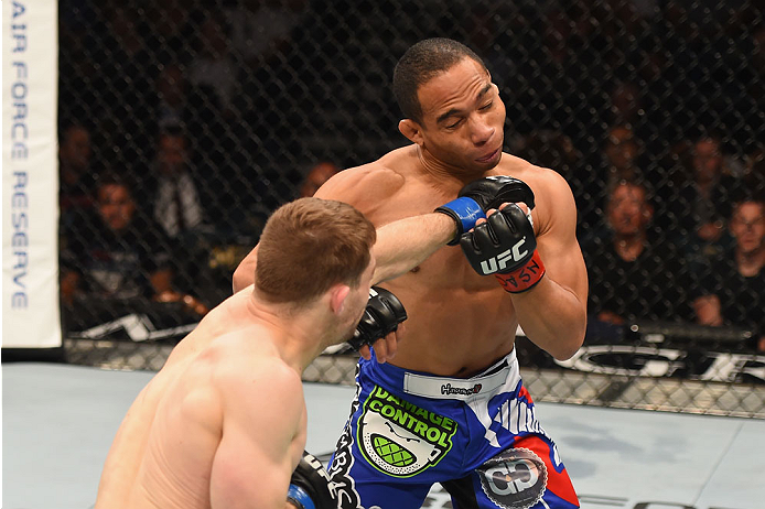 LAS VEGAS, NV - MAY 23: (L-R) Zach Makovsky punches John Dodson in their flyweight bout during the UFC 187 event at the MGM Grand Garden Arena on May 23, 2015 in Las Vegas, Nevada. (Photo by Josh Hedges/Zuffa LLC/Zuffa LLC via Getty Images)