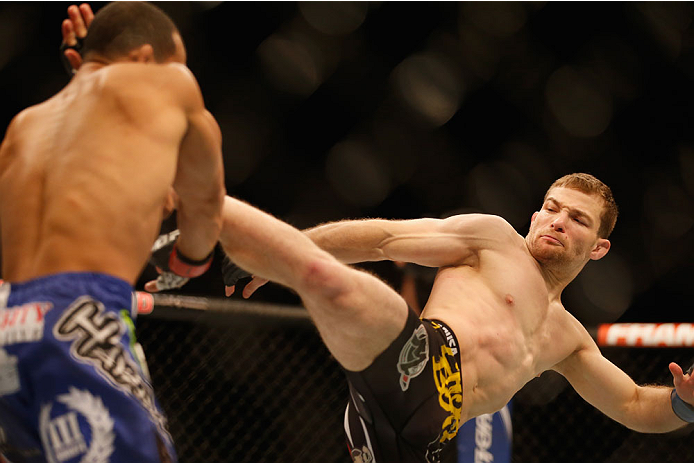 LAS VEGAS, NV - MAY 23:  (R-L) Zach Makovsky kicks John Dodson in their flyweight bout during the UFC 187 event at the MGM Grand Garden Arena on May 23, 2015 in Las Vegas, Nevada.  (Photo by Christian Petersen/Zuffa LLC/Zuffa LLC via Getty Images)