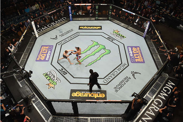 LAS VEGAS, NV - MAY 23: (L-R) Zach Makovsky punches John Dodson in their flyweight bout during the UFC 187 event at the MGM Grand Garden Arena on May 23, 2015 in Las Vegas, Nevada. (Photo by Josh Hedges/Zuffa LLC/Zuffa LLC via Getty Images)