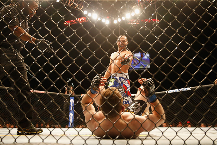 LAS VEGAS, NV - MAY 23:  John Dodson waits for Zach Makovsky to stand up in their flyweight bout during the UFC 187 event at the MGM Grand Garden Arena on May 23, 2015 in Las Vegas, Nevada.  (Photo by Christian Petersen/Zuffa LLC/Zuffa LLC via Getty Image