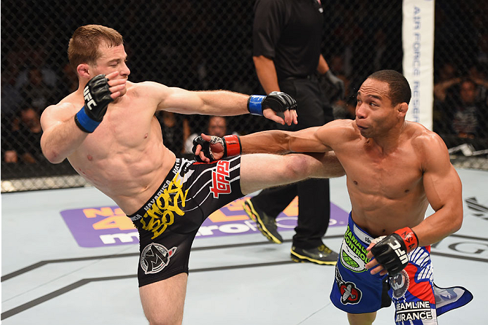 LAS VEGAS, NV - MAY 23:  (L-R) Zach Makovsky kicks John Dodson in their flyweight bout during the UFC 187 event at the MGM Grand Garden Arena on May 23, 2015 in Las Vegas, Nevada.  (Photo by Josh Hedges/Zuffa LLC/Zuffa LLC via Getty Images)