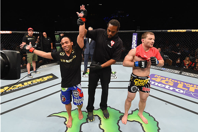 LAS VEGAS, NV - MAY 23: John Dodson (left) reacts to his victory over Zach Makovsky (right) in their flyweight bout during the UFC 187 event at the MGM Grand Garden Arena on May 23, 2015 in Las Vegas, Nevada. (Photo by Josh Hedges/Zuffa LLC/Zuffa LLC vi
