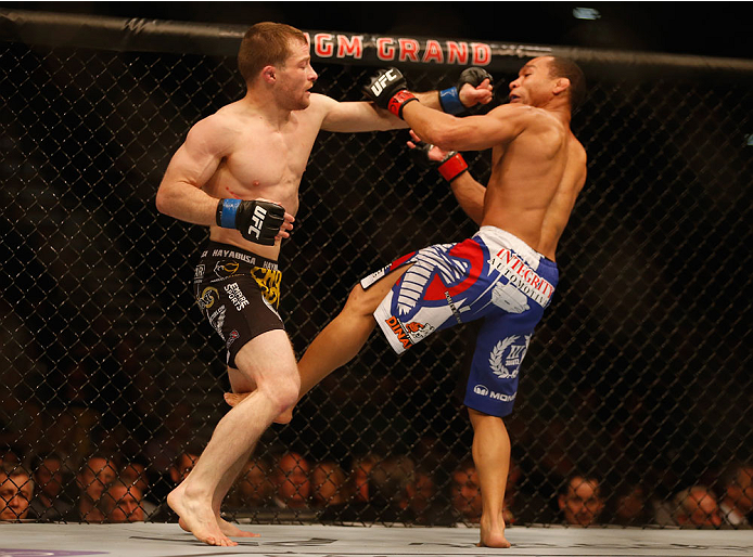 LAS VEGAS, NV - MAY 23:  (L-R) Zach Makovsky punches John Dodson in their flyweight bout during the UFC 187 event at the MGM Grand Garden Arena on May 23, 2015 in Las Vegas, Nevada.  (Photo by Christian Petersen/Zuffa LLC/Zuffa LLC via Getty Images)