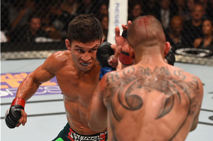 LAS VEGAS, NV - MAY 23: (L-R) Joseph Benavidez punches John Moraga in their flyweight bout during the UFC 187 event at the MGM Grand Garden Arena on May 23, 2015 in Las Vegas, Nevada. (Photo by Josh Hedges/Zuffa LLC/Zuffa LLC via Getty Images)