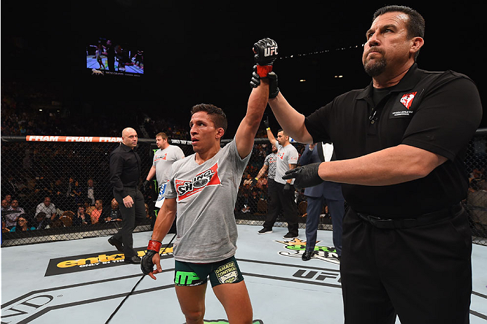 LAS VEGAS, NV - MAY 23:  Joseph Benavidez reacts to his victory over John Moraga in their flyweight bout during the UFC 187 event at the MGM Grand Garden Arena on May 23, 2015 in Las Vegas, Nevada.  (Photo by Josh Hedges/Zuffa LLC/Zuffa LLC via Getty Imag