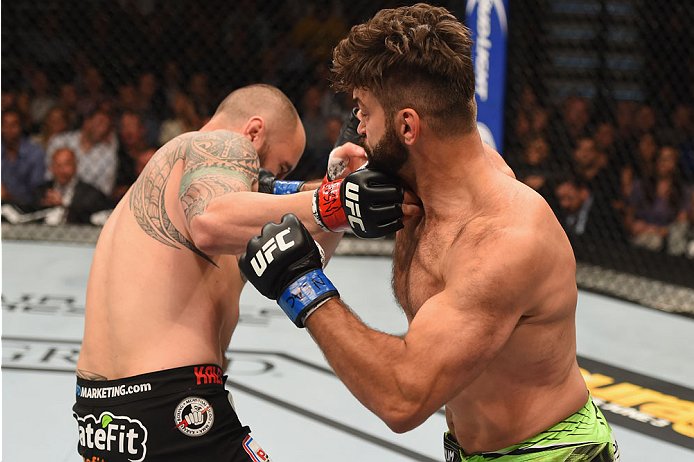 LAS VEGAS, NV - MAY 23: (R-L) Andrei Arlovski and Travis Browne exchange punches in their heavyweight bout during the UFC 187 event at the MGM Grand Garden Arena on May 23, 2015 in Las Vegas, Nevada. (Photo by Josh Hedges/Zuffa LLC/Zuffa LLC via Getty I