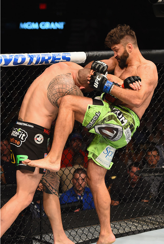 LAS VEGAS, NV - MAY 23:  (R-L) Andrei Arlovski knees Travis Browne in their heavyweight bout during the UFC 187 event at the MGM Grand Garden Arena on May 23, 2015 in Las Vegas, Nevada.  (Photo by Josh Hedges/Zuffa LLC/Zuffa LLC via Getty Images)