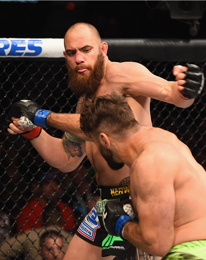 LAS VEGAS, NV - MAY 23: Travis Browne (top) and Andrei Arlovski (bottom) exchange punches in their heavyweight bout during the UFC 187 event at the MGM Grand Garden Arena on May 23, 2015 in Las Vegas, Nevada. (Photo by Josh Hedges/Zuffa LLC/Zuffa LLC vi