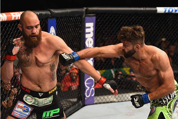 LAS VEGAS, NV - MAY 23:  (R-L) Andrei Arlovski punches Travis Browne in their heavyweight bout during the UFC 187 event at the MGM Grand Garden Arena on May 23, 2015 in Las Vegas, Nevada.  (Photo by Josh Hedges/Zuffa LLC/Zuffa LLC via Getty Images)