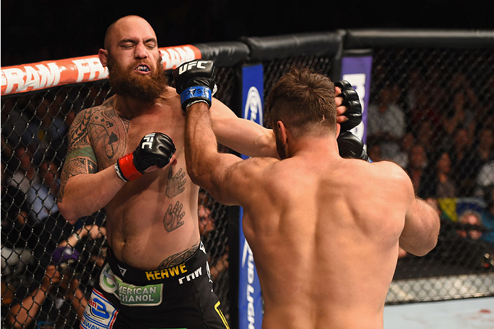 LAS VEGAS, NV - MAY 23:  (L-R) Travis Browne punches Andrei Arlovski in their heavyweight bout during the UFC 187 event at the MGM Grand Garden Arena on May 23, 2015 in Las Vegas, Nevada.  (Photo by Josh Hedges/Zuffa LLC/Zuffa LLC via Getty Images)