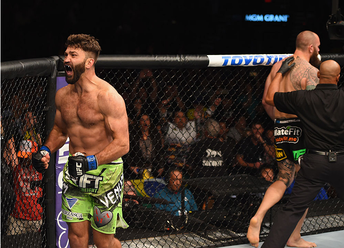 LAS VEGAS, NV - MAY 23:  Andrei Arlovski (left) reacts to his victory over Travis Browne in their heavyweight bout during the UFC 187 event at the MGM Grand Garden Arena on May 23, 2015 in Las Vegas, Nevada.  (Photo by Josh Hedges/Zuffa LLC/Zuffa LLC via 