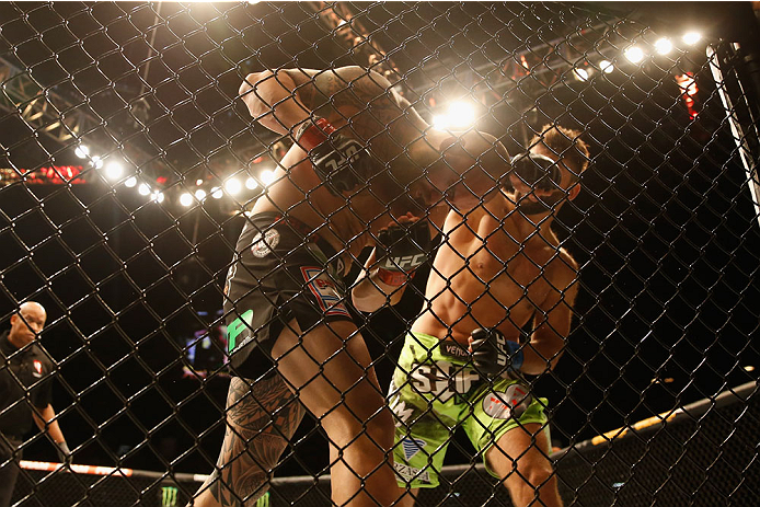 LAS VEGAS, NV - MAY 23:  (R-L) Andrei Arlovski punches Travis Browne in their heavyweight bout during the UFC 187 event at the MGM Grand Garden Arena on May 23, 2015 in Las Vegas, Nevada.  (Photo by Christian Petersen/Zuffa LLC/Zuffa LLC via Getty Images)