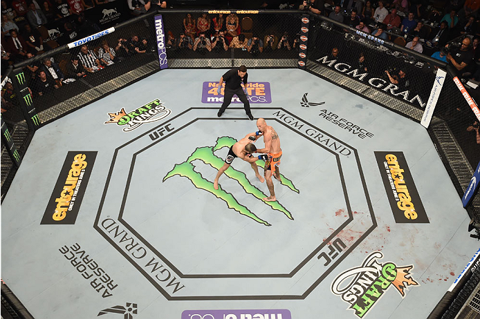 LAS VEGAS, NV - MAY 23:  (L-R) John Makdessi of Canada punches Donald Cerrone in their lightweight bout during the UFC 187 event at the MGM Grand Garden Arena on May 23, 2015 in Las Vegas, Nevada.  (Photo by Josh Hedges/Zuffa LLC/Zuffa LLC via Getty Image