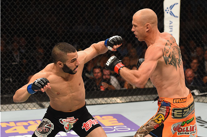 LAS VEGAS, NV - MAY 23:  (L-R) John Makdessi of Canada punches Donald Cerrone in their lightweight bout during the UFC 187 event at the MGM Grand Garden Arena on May 23, 2015 in Las Vegas, Nevada.  (Photo by Josh Hedges/Zuffa LLC/Zuffa LLC via Getty Image