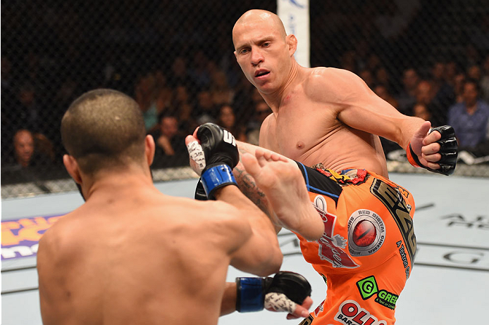 LAS VEGAS, NV - MAY 23:  (R-L) Donald Cerrone kicks John Makdessi of Canada in their lightweight bout during the UFC 187 event at the MGM Grand Garden Arena on May 23, 2015 in Las Vegas, Nevada.  (Photo by Josh Hedges/Zuffa LLC/Zuffa LLC via Getty Images)