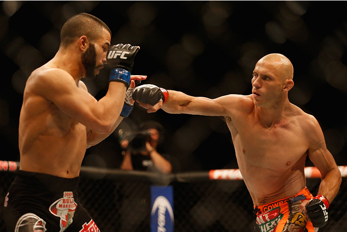 LAS VEGAS, NV - MAY 23: (R-L) Donald Cerrone punches John Makdessi of Canada in their lightweight bout during the UFC 187 event at the MGM Grand Garden Arena on May 23, 2015 in Las Vegas, Nevada. (Photo by Christian Petersen/Zuffa LLC/Zuffa LLC via Gett