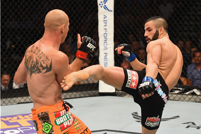 LAS VEGAS, NV - MAY 23:  (R-L) John Makdessi of Canada kicks Donald Cerrone in their lightweight bout during the UFC 187 event at the MGM Grand Garden Arena on May 23, 2015 in Las Vegas, Nevada.  (Photo by Josh Hedges/Zuffa LLC/Zuffa LLC via Getty Images)