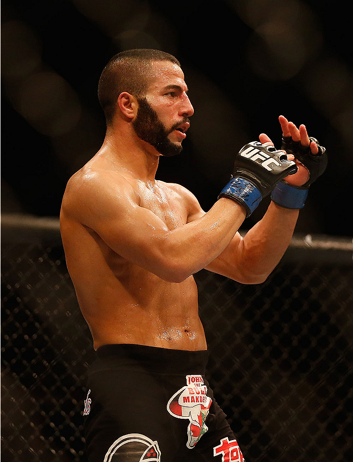 LAS VEGAS, NV - MAY 23: John Makdessi of Canada signals the end to his lightweight bout against Donald Cerrone during the UFC 187 event at the MGM Grand Garden Arena on May 23, 2015 in Las Vegas, Nevada. (Photo by Christian Petersen/Zuffa LLC/Zuffa LLC