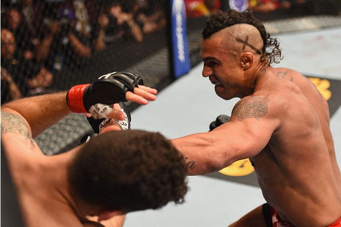 LAS VEGAS, NV - MAY 23:  (R-L) Vitor Belfort of Brazil punches Chris Weidman in their UFC middleweight championship bout during the UFC 187 event at the MGM Grand Garden Arena on May 23, 2015 in Las Vegas, Nevada.  (Photo by Josh Hedges/Zuffa LLC/Zuffa LL