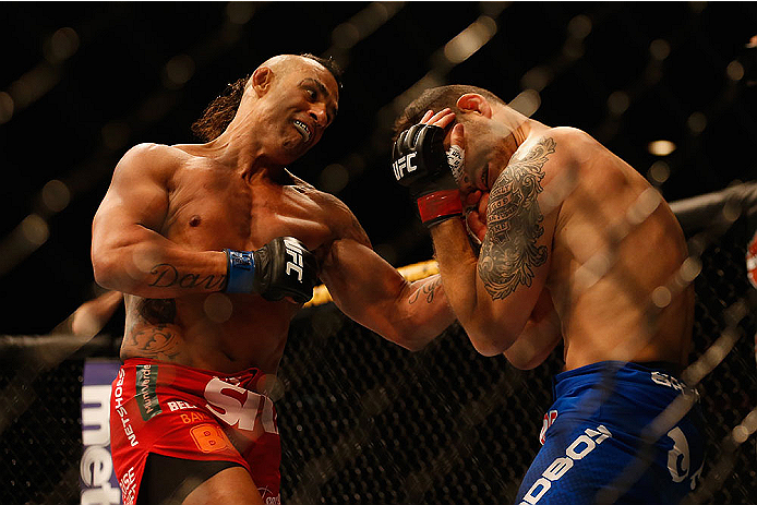 LAS VEGAS, NV - MAY 23:  (L-R) Vitor Belfort of Brazil punches Chris Weidman in their UFC middleweight championship bout during the UFC 187 event at the MGM Grand Garden Arena on May 23, 2015 in Las Vegas, Nevada.  (Photo by Christian Petersen/Zuffa LLC/Z