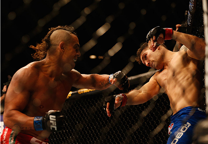 LAS VEGAS, NV - MAY 23:  (L-R) Vitor Belfort of Brazil punches Chris Weidman in their UFC middleweight championship bout during the UFC 187 event at the MGM Grand Garden Arena on May 23, 2015 in Las Vegas, Nevada.  (Photo by Christian Petersen/Zuffa LLC/Z