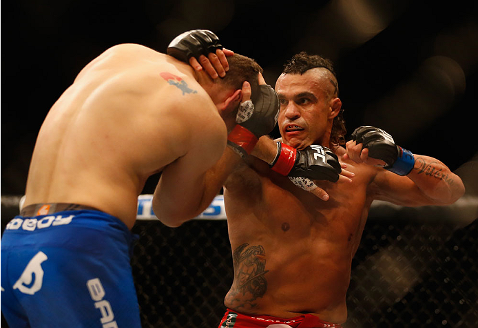 LAS VEGAS, NV - MAY 23:  (R-L) Vitor Belfort of Brazil punches Chris Weidman in their UFC middleweight championship bout during the UFC 187 event at the MGM Grand Garden Arena on May 23, 2015 in Las Vegas, Nevada.  (Photo by Christian Petersen/Zuffa LLC/Z