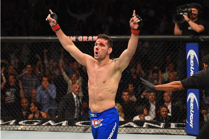 LAS VEGAS, NV - MAY 23: Chris Weidman reacts to his victory over Vitor Belfort of Brazil in their UFC middleweight championship bout during the UFC 187 event at the MGM Grand Garden Arena on May 23, 2015 in Las Vegas, Nevada. (Photo by Josh Hedges/Zuffa