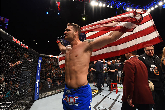 LAS VEGAS, NV - MAY 23:  Chris Weidman reacts to his victory over Vitor Belfort of Brazil in their UFC middleweight championship bout during the UFC 187 event at the MGM Grand Garden Arena on May 23, 2015 in Las Vegas, Nevada.  (Photo by Josh Hedges/Zuffa