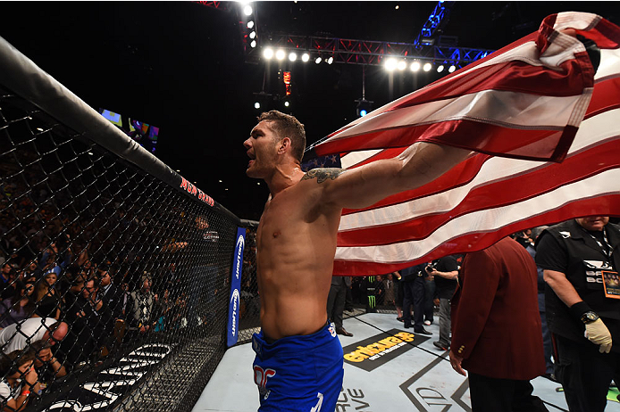 LAS VEGAS, NV - MAY 23:  Chris Weidman reacts to his victory over Vitor Belfort of Brazil in their UFC middleweight championship bout during the UFC 187 event at the MGM Grand Garden Arena on May 23, 2015 in Las Vegas, Nevada.  (Photo by Josh Hedges/Zuffa