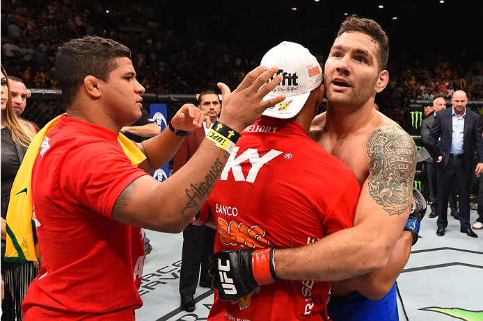 LAS VEGAS, NV - MAY 23:  (R-L) Chris Weidman and Vitor Belfort of Brazil embrace after their UFC middleweight championship bout during the UFC 187 event at the MGM Grand Garden Arena on May 23, 2015 in Las Vegas, Nevada.  (Photo by Josh Hedges/Zuffa LLC/Z