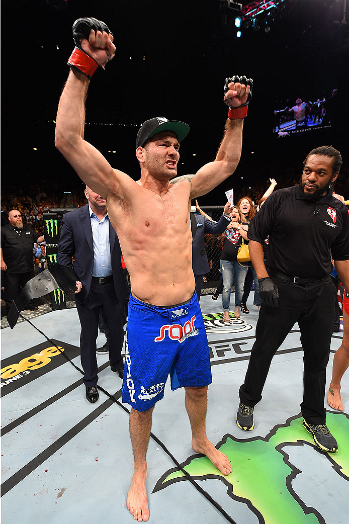 LAS VEGAS, NV - MAY 23: Chris Weidman reacts to his victory over Vitor Belfort of Brazil in their UFC middleweight championship bout during the UFC 187 event at the MGM Grand Garden Arena on May 23, 2015 in Las Vegas, Nevada. (Photo by Josh Hedges/Zuffa
