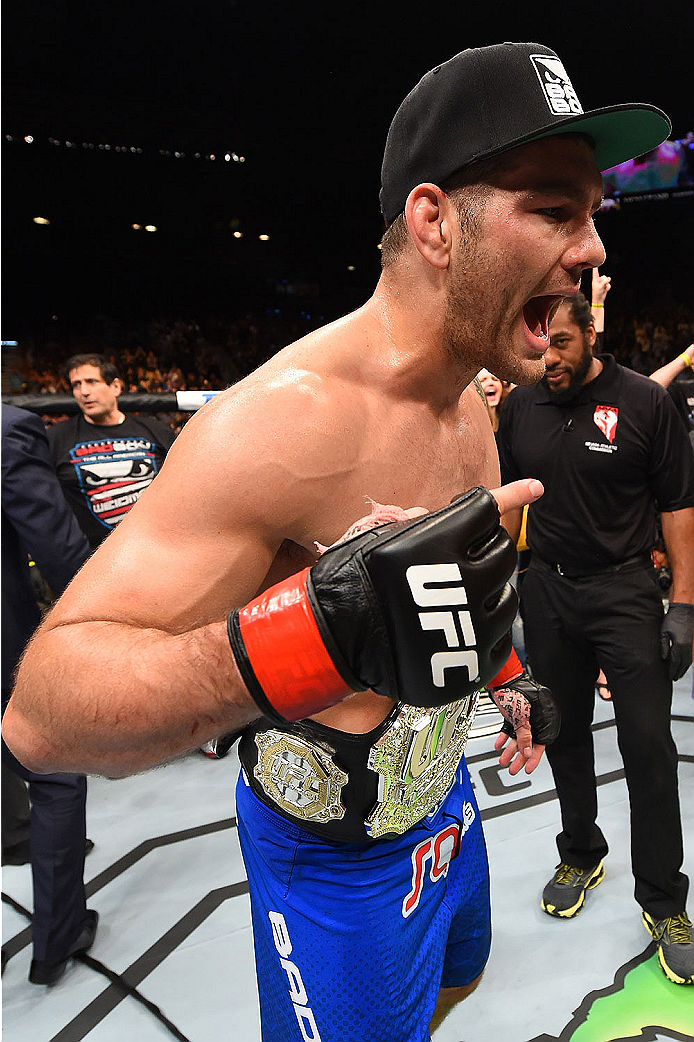 LAS VEGAS, NV - MAY 23: Chris Weidman reacts to his victory over Vitor Belfort of Brazil in their UFC middleweight championship bout during the UFC 187 event at the MGM Grand Garden Arena on May 23, 2015 in Las Vegas, Nevada. (Photo by Josh Hedges/Zuffa