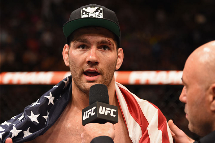 LAS VEGAS, NV - MAY 23: Chris Weidman speaks with Joe Rogan after his UFC middleweight championship bout during the UFC 187 event at the MGM Grand Garden Arena on May 23, 2015 in Las Vegas, Nevada. (Photo by Josh Hedges/Zuffa LLC/Zuffa LLC via Getty Ima