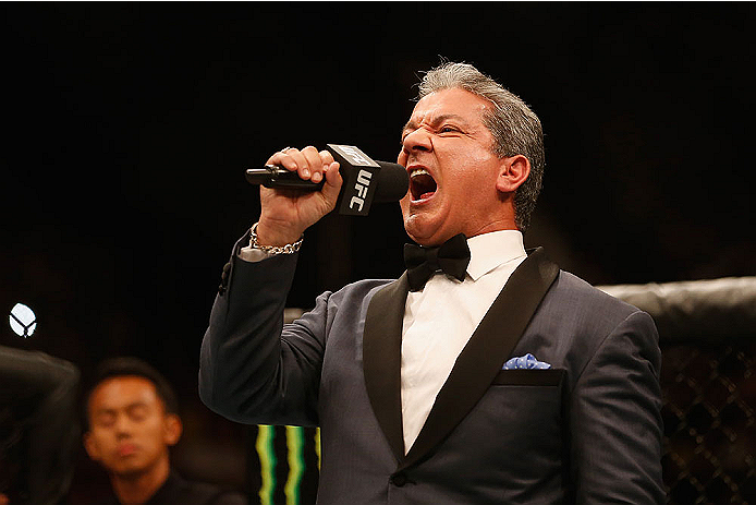 LAS VEGAS, NV - MAY 23: Bruce Buffer introduces Anthony Johnson and Daniel Cormier before their UFC light heavyweight championship bout during the UFC 187 event at the MGM Grand Garden Arena on May 23, 2015 in Las Vegas, Nevada. (Photo by Christian Pete