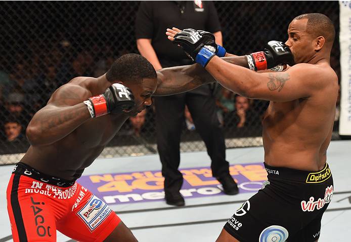 LAS VEGAS, NV - MAY 23:  (L-R) Anthony Johnson punches Daniel Cormier in their UFC light heavyweight championship bout during the UFC 187 event at the MGM Grand Garden Arena on May 23, 2015 in Las Vegas, Nevada.  (Photo by Josh Hedges/Zuffa LLC/Zuffa LLC 