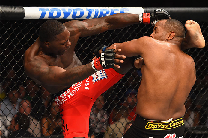 LAS VEGAS, NV - MAY 23:  (L-R) Anthony Johnson kicks Daniel Cormier in their UFC light heavyweight championship bout during the UFC 187 event at the MGM Grand Garden Arena on May 23, 2015 in Las Vegas, Nevada.  (Photo by Josh Hedges/Zuffa LLC/Zuffa LLC vi