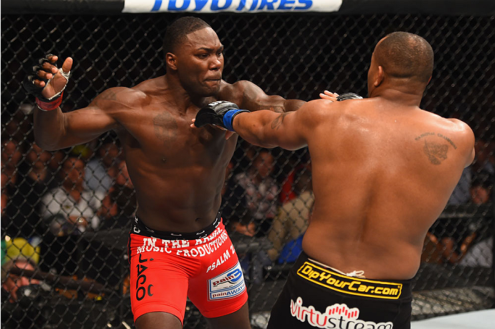 LAS VEGAS, NV - MAY 23:  (L-R) Anthony Johnson punches Daniel Cormier in their UFC light heavyweight championship bout during the UFC 187 event at the MGM Grand Garden Arena on May 23, 2015 in Las Vegas, Nevada.  (Photo by Josh Hedges/Zuffa LLC/Zuffa LLC 