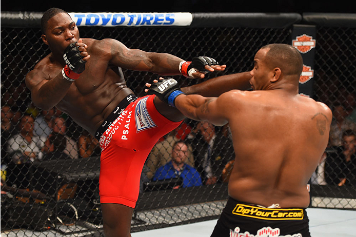 LAS VEGAS, NV - MAY 23:  (L-R) Anthony Johnson kicks Daniel Cormier in their UFC light heavyweight championship bout during the UFC 187 event at the MGM Grand Garden Arena on May 23, 2015 in Las Vegas, Nevada.  (Photo by Josh Hedges/Zuffa LLC/Zuffa LLC vi