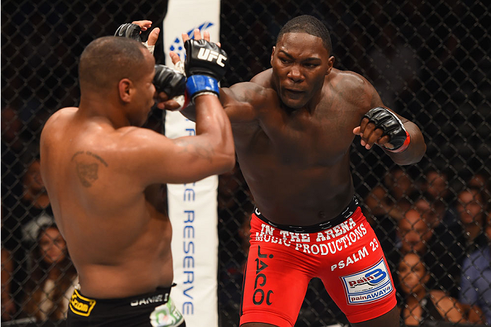 LAS VEGAS, NV - MAY 23:  (R-L) Anthony Johnson punches Daniel Cormier in their UFC light heavyweight championship bout during the UFC 187 event at the MGM Grand Garden Arena on May 23, 2015 in Las Vegas, Nevada.  (Photo by Josh Hedges/Zuffa LLC/Zuffa LLC 