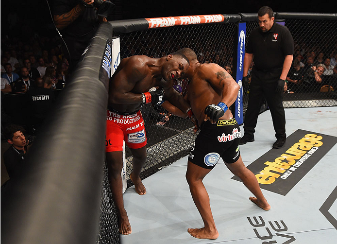 LAS VEGAS, NV - MAY 23:  (R-L) Daniel Cormier punches Anthony Johnson in their UFC light heavyweight championship bout during the UFC 187 event at the MGM Grand Garden Arena on May 23, 2015 in Las Vegas, Nevada.  (Photo by Josh Hedges/Zuffa LLC/Zuffa LLC 