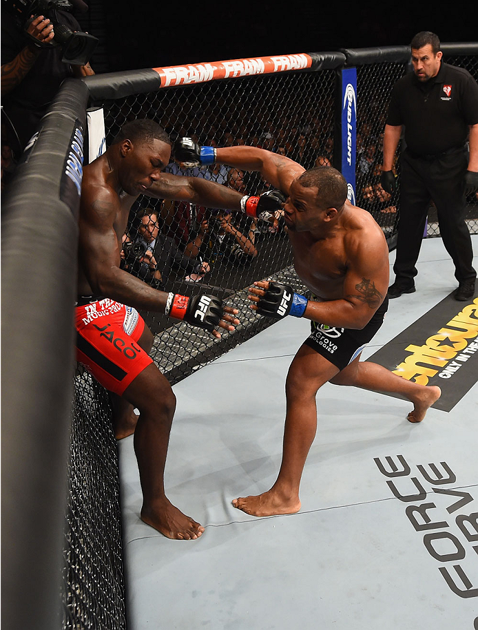 LAS VEGAS, NV - MAY 23: (R-L) Daniel Cormier punches Anthony Johnson in their UFC light heavyweight championship bout during the UFC 187 event at the MGM Grand Garden Arena on May 23, 2015 in Las Vegas, Nevada. (Photo by Josh Hedges/Zuffa LLC/Zuffa LLC