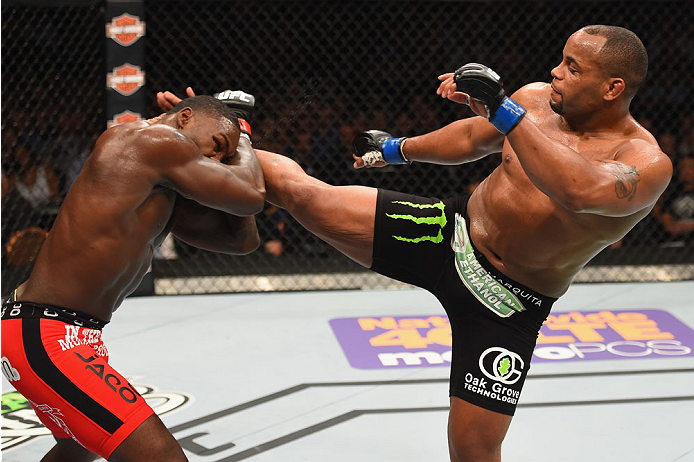 LAS VEGAS, NV - MAY 23: (R-L) Daniel Cormier kicks Anthony Johnson in their UFC light heavyweight championship bout during the UFC 187 event at the MGM Grand Garden Arena on May 23, 2015 in Las Vegas, Nevada. (Photo by Josh Hedges/Zuffa LLC/Zuffa LLC vi