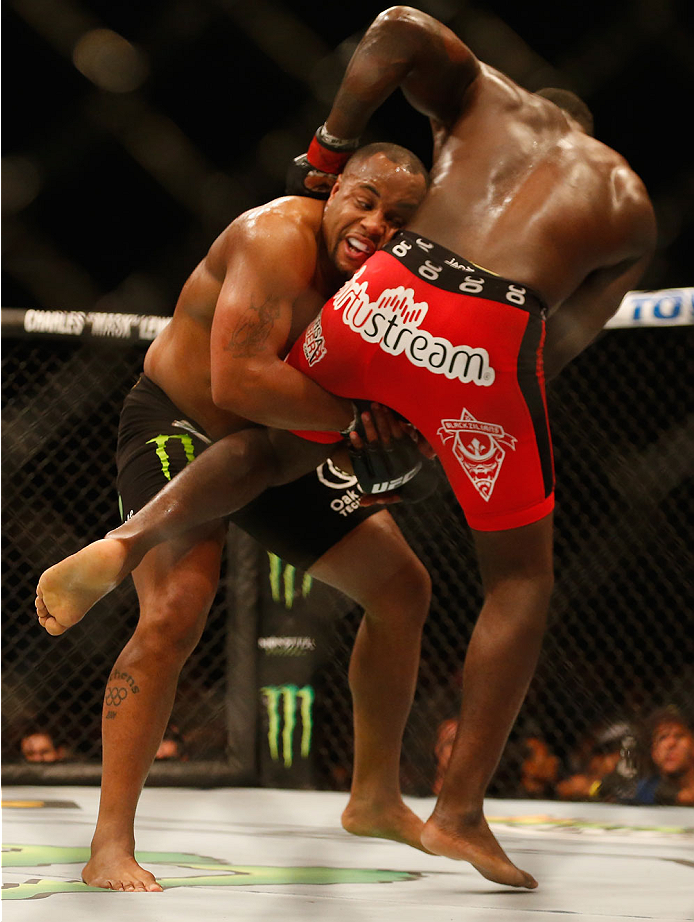 LAS VEGAS, NV - MAY 23:  (L-R) Daniel Cormier attempts to take down Anthony Johnson in their UFC light heavyweight championship bout during the UFC 187 event at the MGM Grand Garden Arena on May 23, 2015 in Las Vegas, Nevada.  (Photo by Christian Petersen