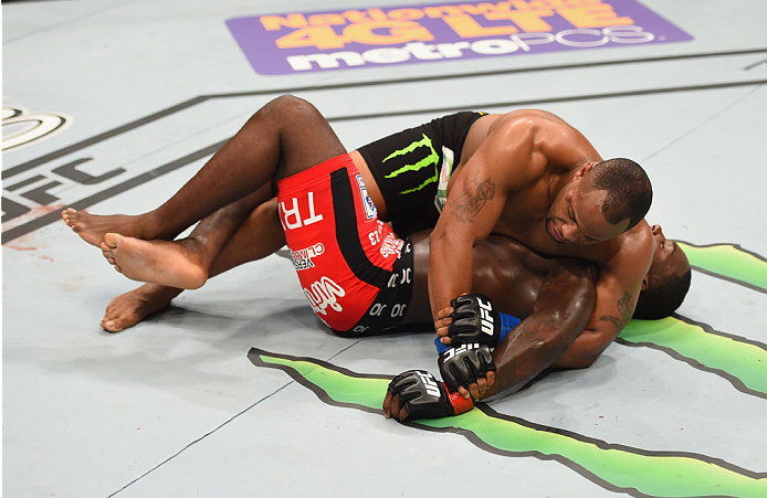 LAS VEGAS, NV - MAY 23: Daniel Cormier (top) attempts to submit Anthony Johnson in their UFC light heavyweight championship bout during the UFC 187 event at the MGM Grand Garden Arena on May 23, 2015 in Las Vegas, Nevada. (Photo by Josh Hedges/Zuffa LLC
