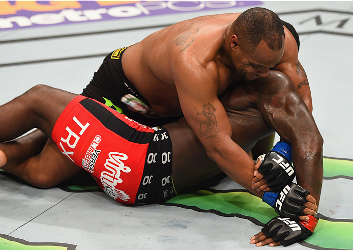 LAS VEGAS, NV - MAY 23:  Daniel Cormier (top) attempts to submit Anthony Johnson in their UFC light heavyweight championship bout during the UFC 187 event at the MGM Grand Garden Arena on May 23, 2015 in Las Vegas, Nevada.  (Photo by Josh Hedges/Zuffa LLC