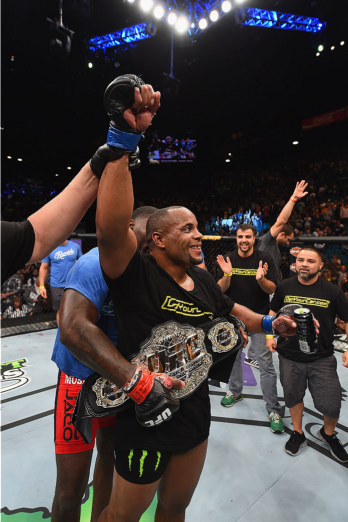 LAS VEGAS, NV - MAY 23:  Daniel Cormier reacts to his victory over Anthony Johnson in their UFC light heavyweight championship bout during the UFC 187 event at the MGM Grand Garden Arena on May 23, 2015 in Las Vegas, Nevada.  (Photo by Josh Hedges/Zuffa L