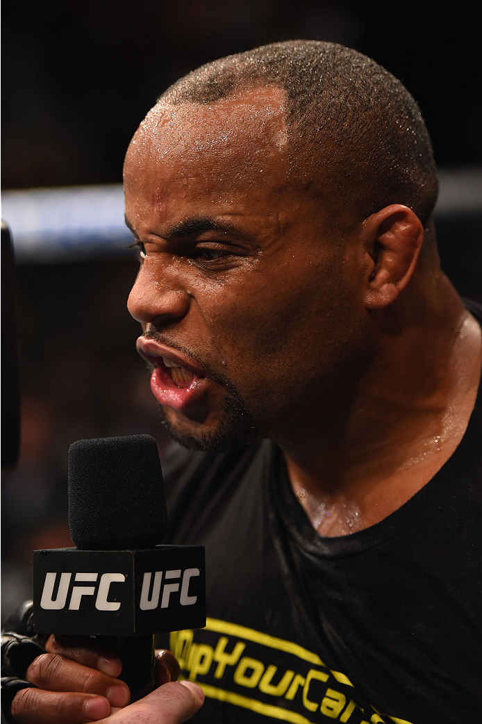 LAS VEGAS, NV - MAY 23:  Daniel Cormier speaks to Joe Rogan after his victory over Anthony Johnson in their UFC light heavyweight championship bout during the UFC 187 event at the MGM Grand Garden Arena on May 23, 2015 in Las Vegas, Nevada.  (Photo by Jos